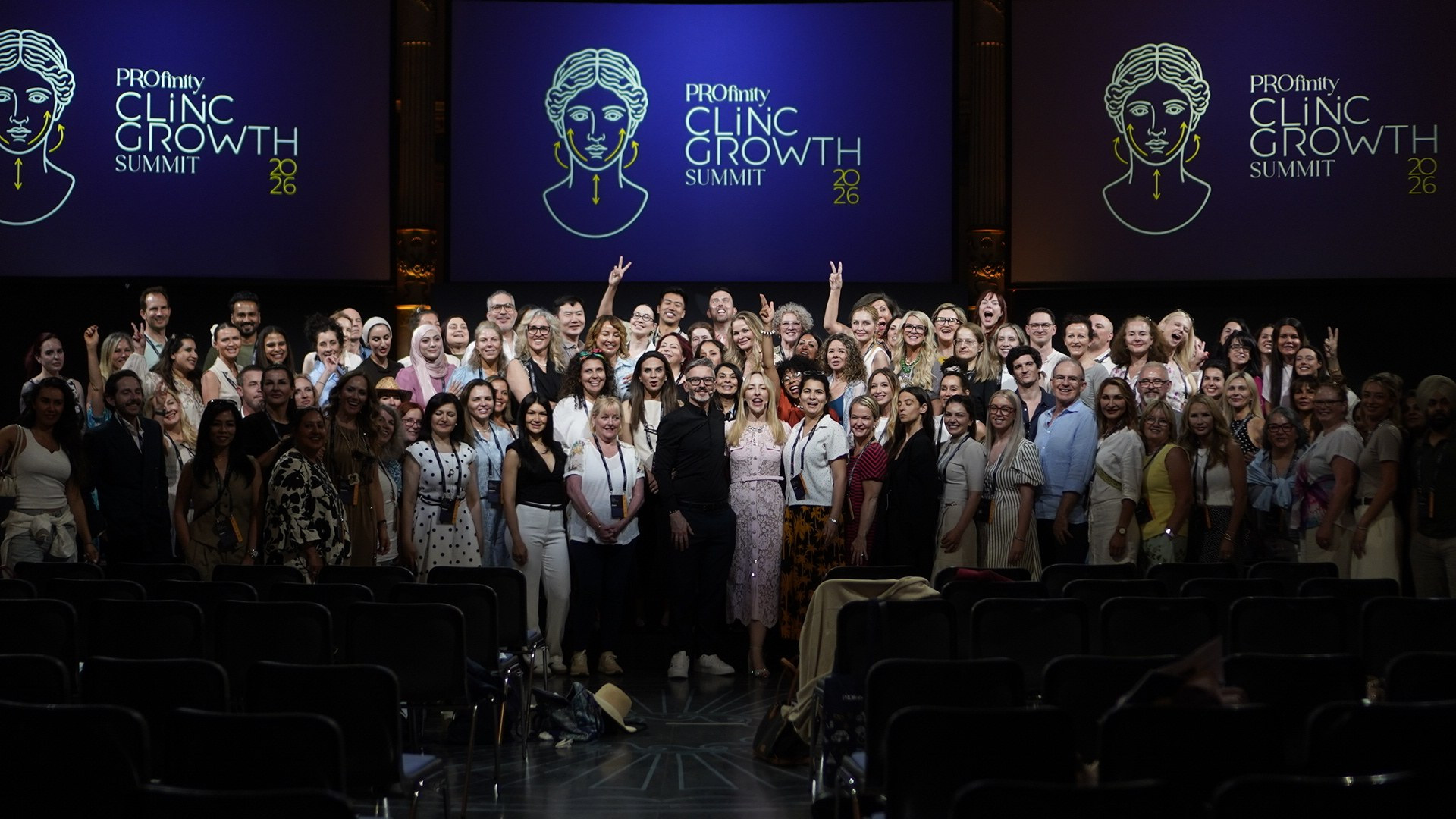 Several hundred doctors and nurses gathered on stage at the Profinity Clinic Growth Summit in Rome, June 2026, with Dr Tim Pearce among them