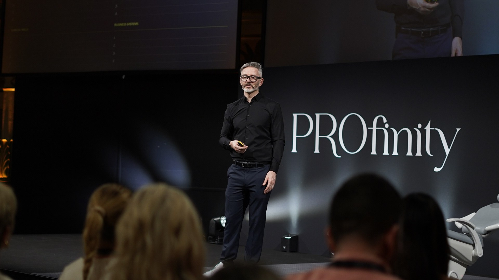Dr Tim Pearce speaking on stage at the Profinity Clinic Growth Summit in Rome, June 2026